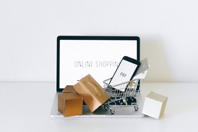 Image depicts key elements of online shopping such as shopping cart, cards, covers, etc.